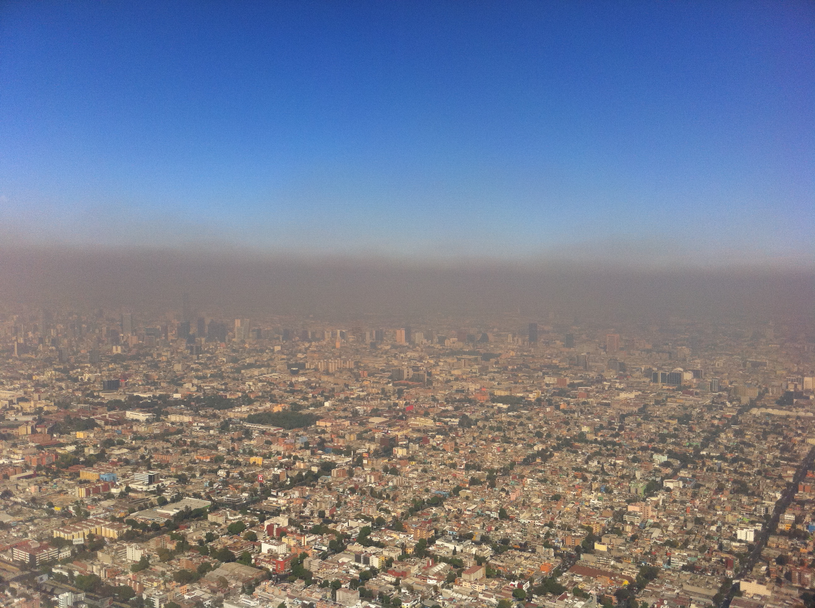 Dense layer of smog and airborne particles above an urban area